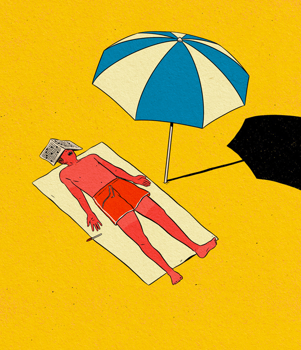 man lying in the sun at the beach with burned skin
