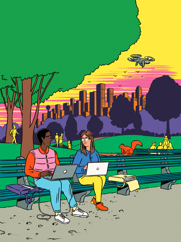 couple using laptops in a park 