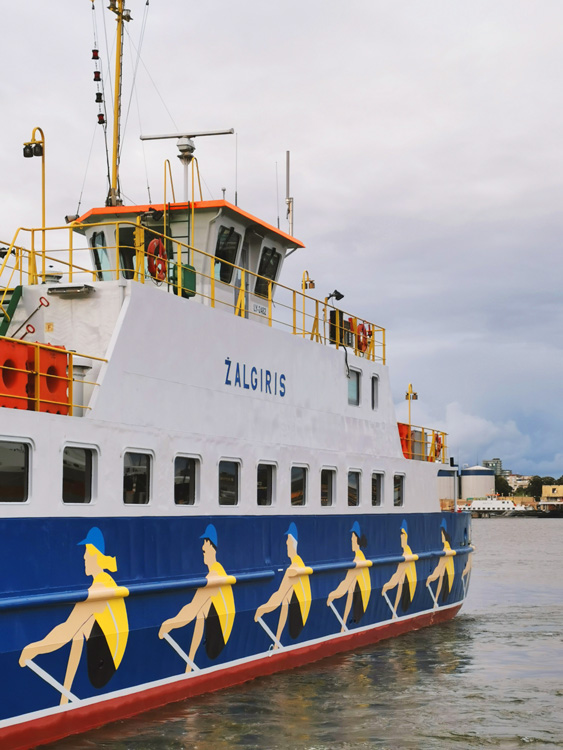 detail of ferry with painted rowers on side