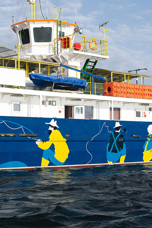 detail of ferry with painted fishermen on side