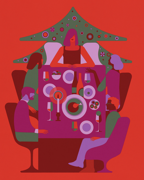 people around a table with festive meal at Christmas