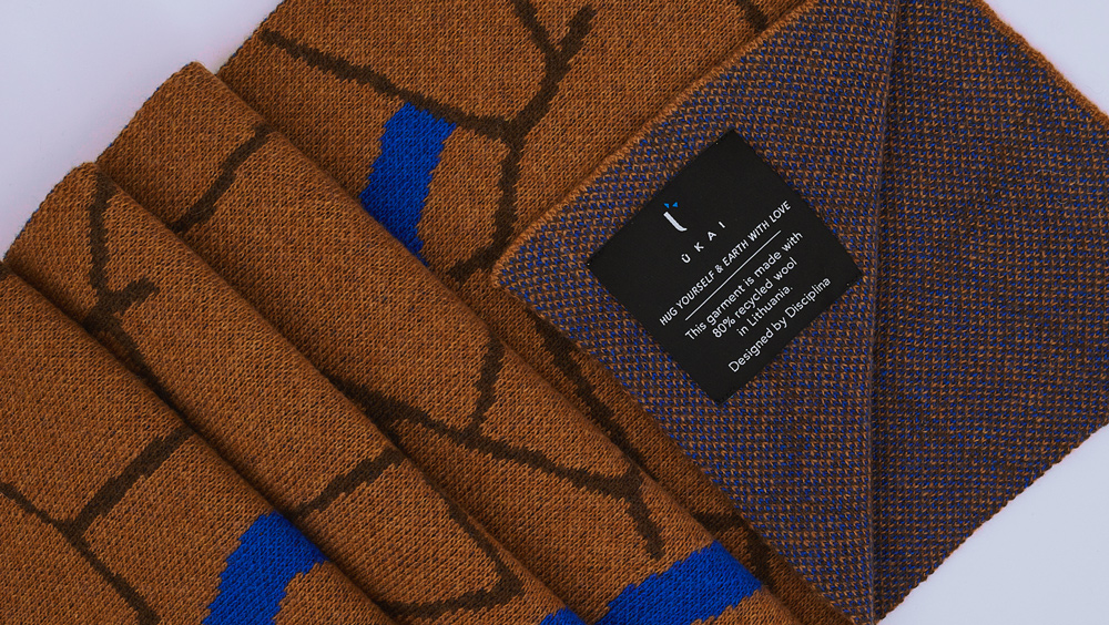 close up photo of a scarf with the label of sustainability