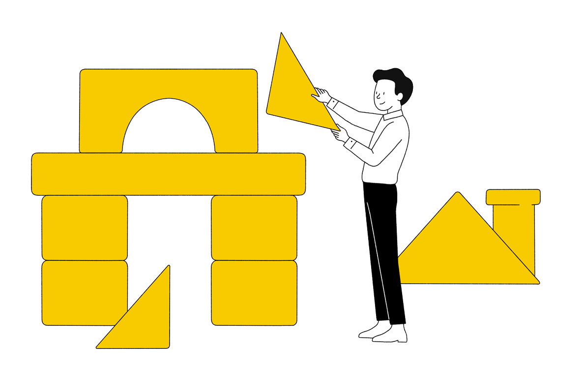 man building a house with building blocks 