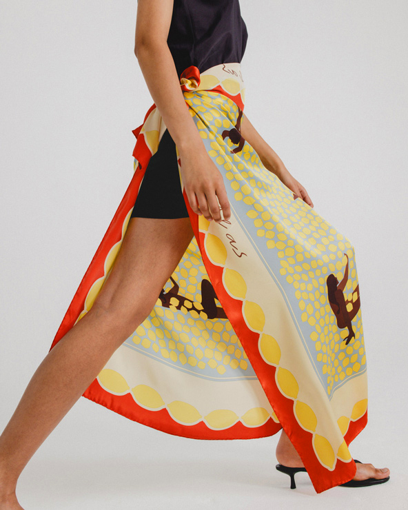 woman wearing designed scarf as skirt 