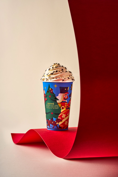photo of coffee cup with nutcracker and Christmas tree 