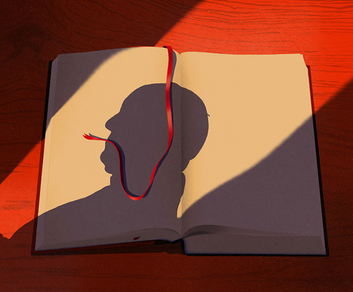 a bookmark lying on the shadow of a face 